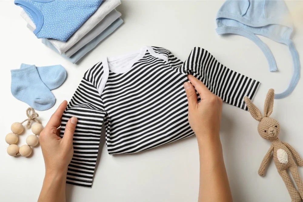 how to fold baby footie pajamas