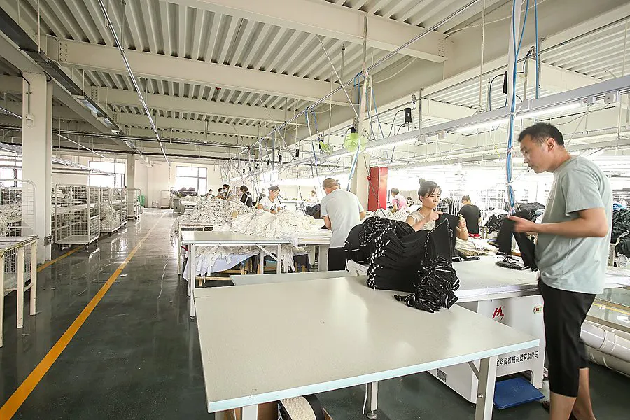 inside pajama factory sewing operator